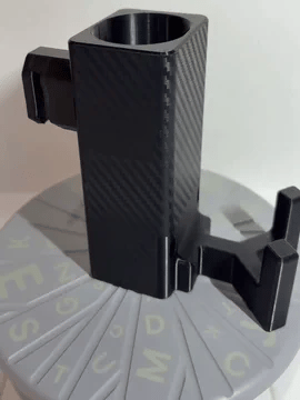 A rotating black Paddle Saver™ with an attached Carbon Control skin. The skin makes the product appear to look like it is made of carbon fiber material.