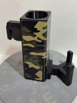 A rotating black Paddle Saver™ with an attached Concrete Jungle skin. The skin has a military theme with a typical camouflage design.