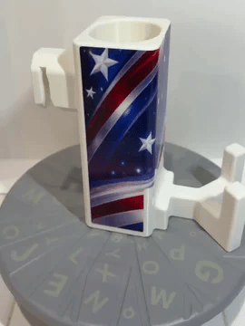 A rotating white Paddle Saver™ with an attached Freedom Rally skin. The skin has a patriotic theme with an array of stars and stripes in red white and blue.