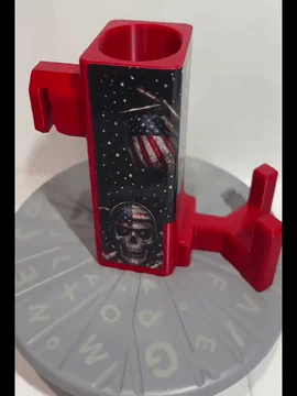 A rotating red Paddle Saver™ with an attached Net Reaper skin. The skin has a graveyard patriot theme with American flags and flag helmet wearing skulls. 