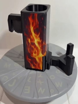 A rotating black Paddle Saver™ with an attached Third Shot Inferno skin. The skin has a pyro theme with searing flames against a black background.