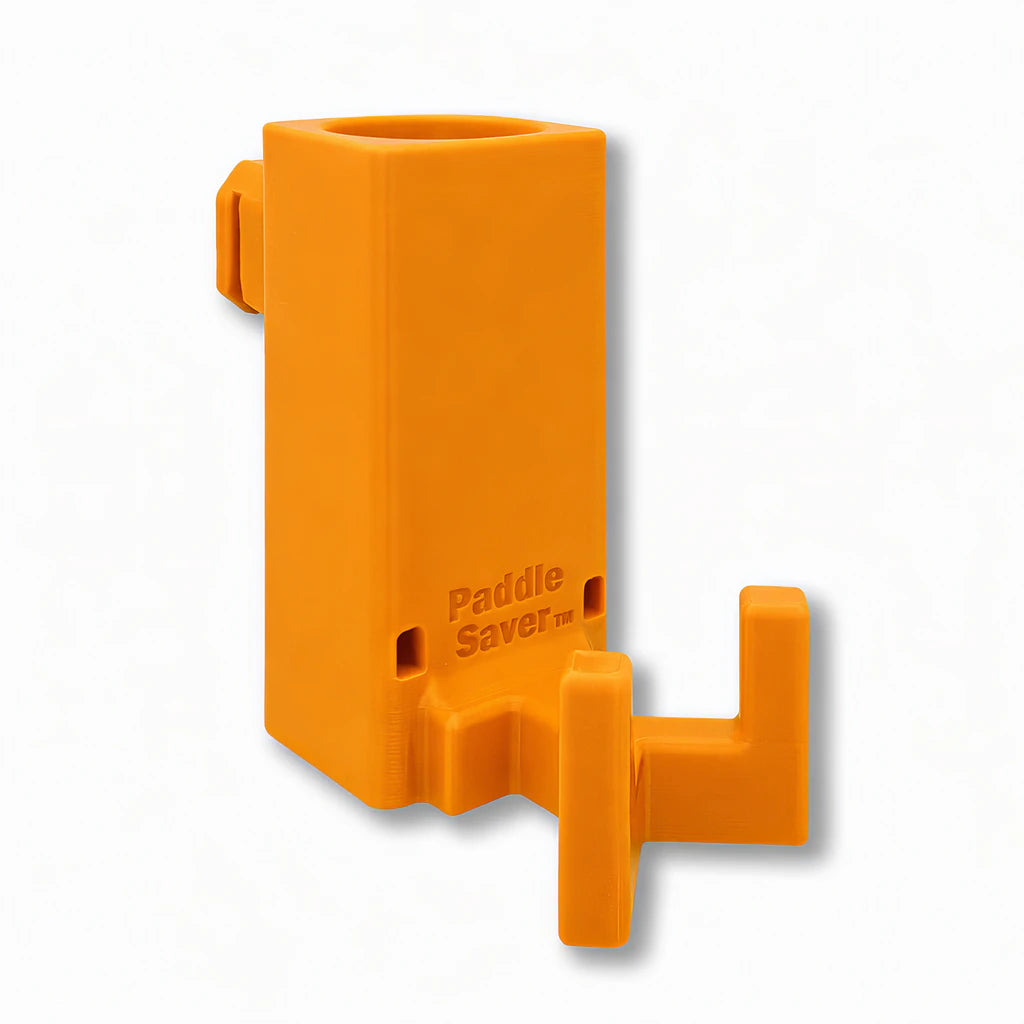 Paddle Saver™ in orange. Patented fence mounted pickleball paddle holder.