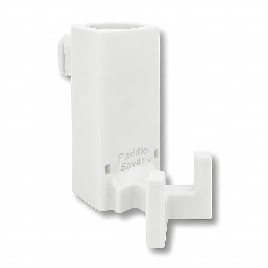 Paddle Saver™ in white. Patented fence mounted pickleball paddle holder.